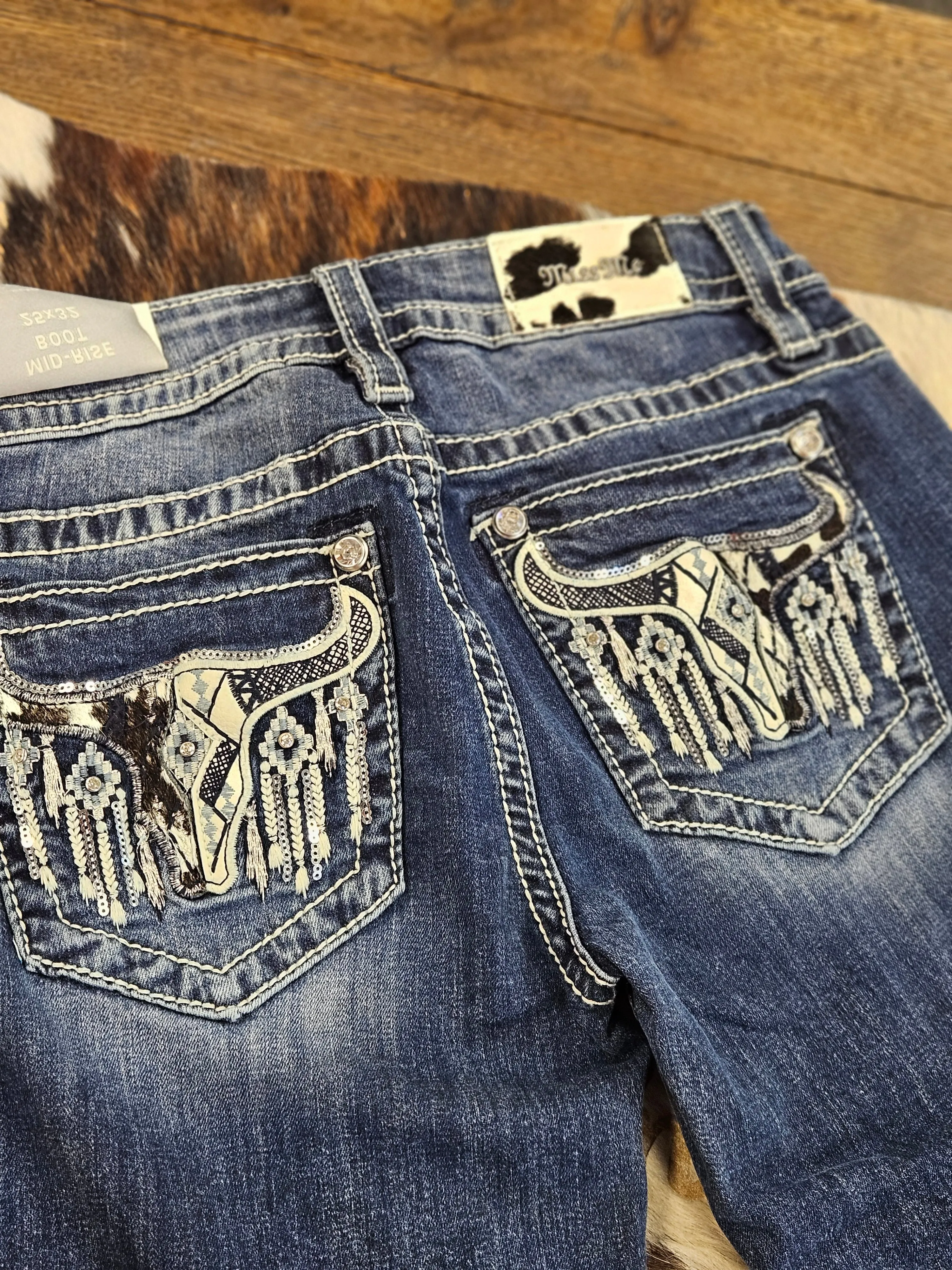 MISS ME WOMENS DARK WASH MID RISE FAUX COWHIDE LONGHORN BOOTCUT STRETCH DENIM JEANS